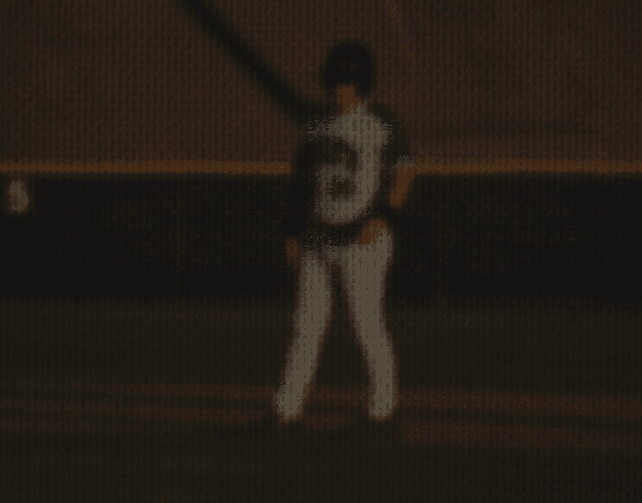 A baseball player is standing on the field, wearing a blue and white uniform. AI generated content