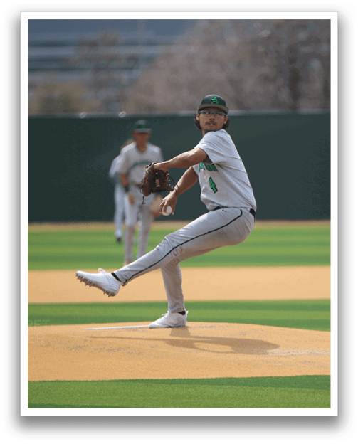 A baseball player in a white uniform is pitching a ball on a field. AI generated content
