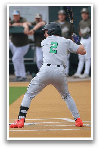 A baseball player is at bat, holding a bat and preparing to swing. AI generated content