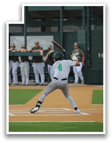 A baseball player in a white uniform is swinging a bat at a ball. AI generated content