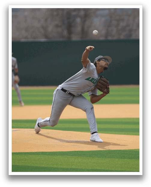 A baseball player in a white uniform is pitching a ball on a field. AI generated content