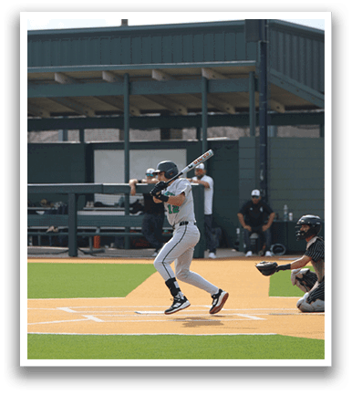 A baseball player is swinging a bat on a field. AI generated content