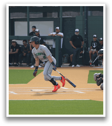 A baseball player is running towards home plate, holding a bat. AI generated content