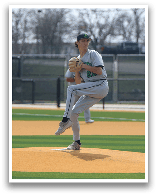 A baseball player in a white uniform is pitching a ball on a field. AI generated content