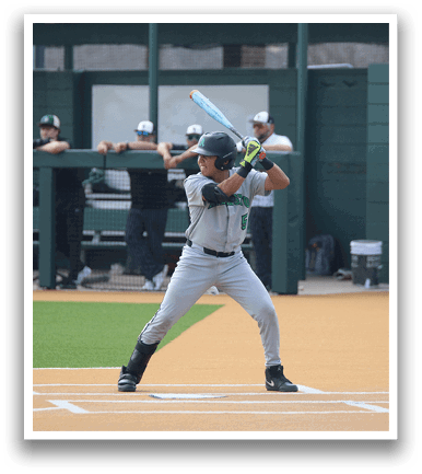 A baseball player is at bat, holding a bat and preparing to swing. AI generated content
