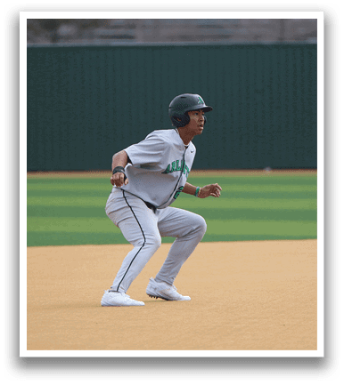 A baseball player is running on the field, wearing a grey and white uniform. AI generated content