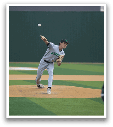 A baseball player in a grey uniform is pitching a ball on a field. AI generated content