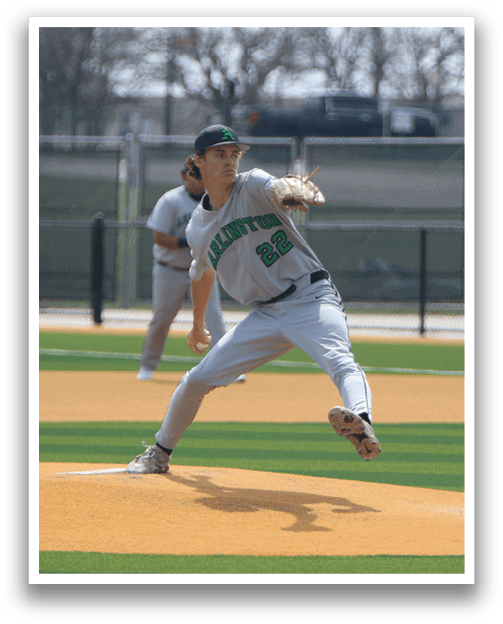 A baseball player in a white uniform is pitching a ball on a field. AI generated content