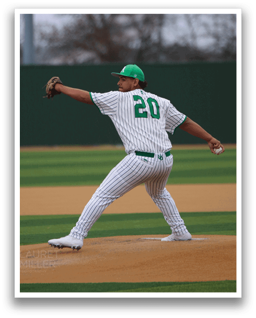 A baseball player in a green and white uniform is pitching a ball on a field. AI generated content
