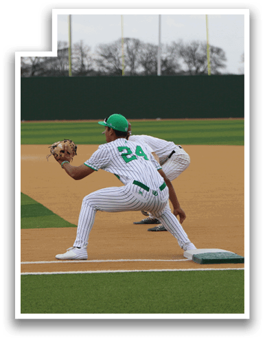 A baseball player wearing a green hat and jersey is in the process of catching a ball. AI generated content