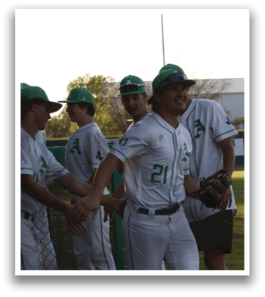 A group of baseball players wearing green and white uniforms are standing together on a field. AI generated content