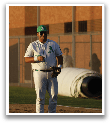 A baseball player in a white uniform is standing on the field, holding a bat. AI generated content