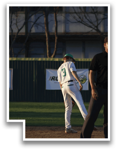 A baseball player is standing on the field, wearing a white uniform and a green shirt. He is holding his glove in his hand. AI generated content