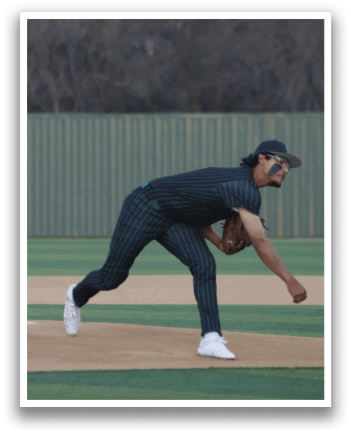 A baseball player in a black and white striped uniform is bending over to catch a ball. AI generated content