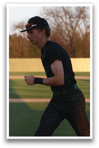 A baseball player is standing on the field, wearing a black and green striped shirt and a black hat. He is holding a baseball bat and appears to be getting ready to hit the ball. AI generated content