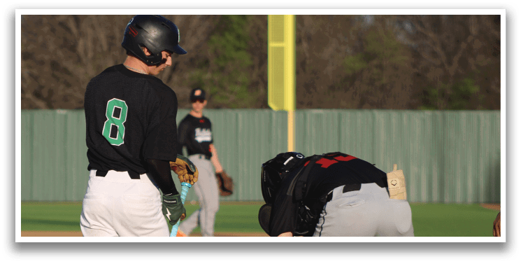 A baseball player is holding a bat and standing next to a catcher who is kneeling down. AI generated content
