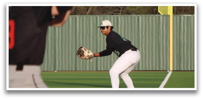 A baseball player is holding a bat, preparing to swing at a ball. AI generated content