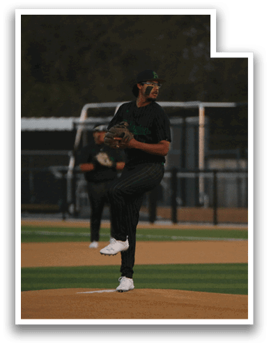 A baseball player in a black shirt and white shoes is pitching a ball on a field. AI generated content