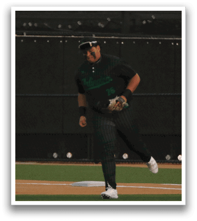 A baseball player is standing on the field, wearing a green shirt and a baseball glove, ready to catch a ball. AI generated content