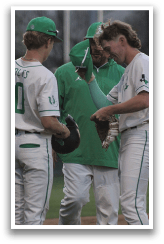 Two baseball players shake hands with a coach on the field. AI generated content