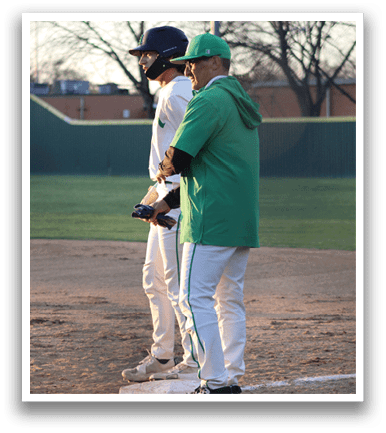 Two men are standing on a baseball field, one of them wearing a green shirt and a black helmet. The other man is holding a baseball bat. AI generated content