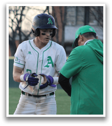 A baseball player wearing a helmet and a green and white uniform stands on the field. AI generated content