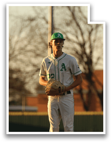 A baseball player wearing a green hat and a white uniform stands on a field. AI generated content