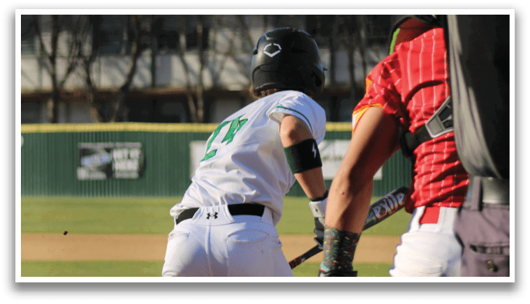 A baseball player is running towards home plate, wearing a helmet and holding a bat. The catcher is waiting to catch the ball. AI generated content