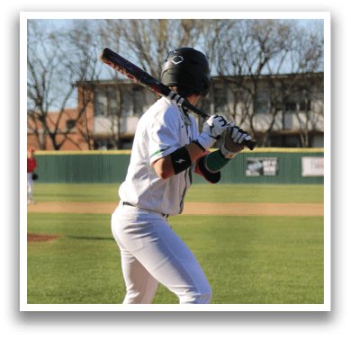 A baseball player in a black shirt and white pants is pitching a ball on a field. AI generated content