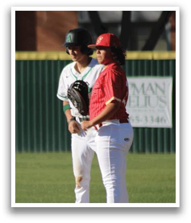 Two baseball players on the field, one wearing a red shirt and the other wearing a green and white shirt. The player in the red shirt is holding a baseball bat. AI generated content