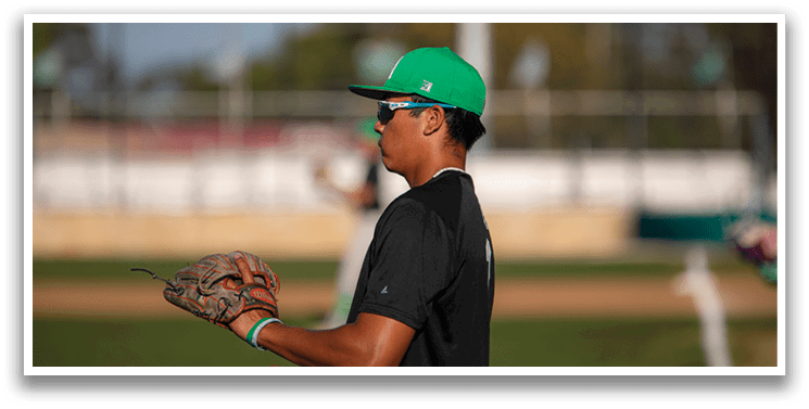A baseball player wearing a green hat and black shirt is holding a catcher's mitt. AI generated content