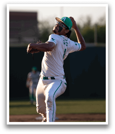 A baseball player in a green and gray uniform is pitching a ball. AI generated content