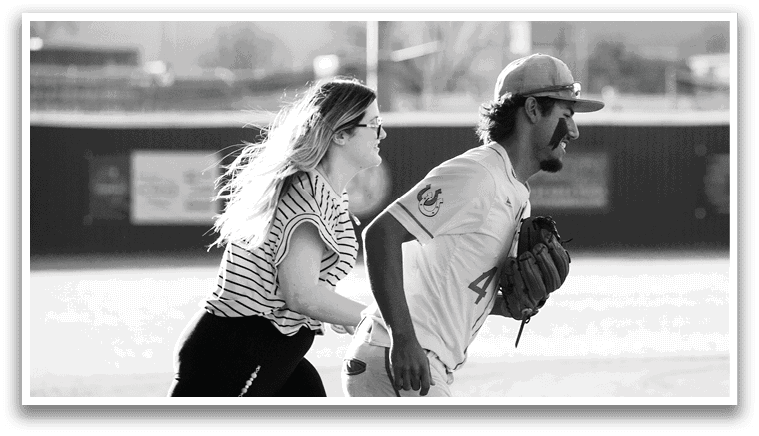 A man and woman are playing baseball. The man is holding a baseball glove and the woman is running. AI generated content