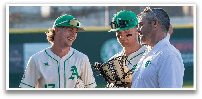 Three baseball players wearing green and white uniforms are standing on a field. One player is holding a baseball glove. AI generated content