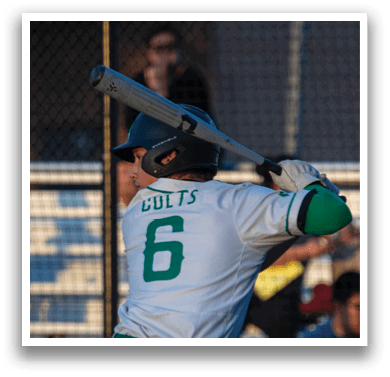 A baseball player in a white uniform with the number 6 on the back is holding a bat and preparing to swing. AI generated content