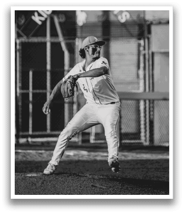 A baseball player in a white uniform is pitching a ball. AI generated content