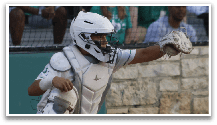 A baseball catcher is in the process of catching a ball, with a crowd of people watching. AI generated content