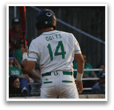 A baseball player in a white uniform with the number 14 on the back is holding a bat and getting ready to hit the ball. AI generated content