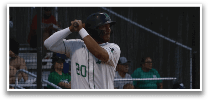 A baseball player is at bat, holding a bat and preparing to swing. AI generated content