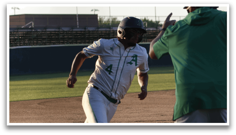 A baseball player is running towards home plate, while a teammate is trying to tag him out. AI generated content