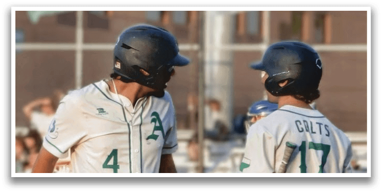Two baseball players wearing white uniforms are walking on the field. AI generated content