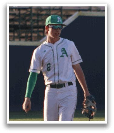 A baseball player in a white uniform is standing on a field, holding a baseball glove. AI generated content