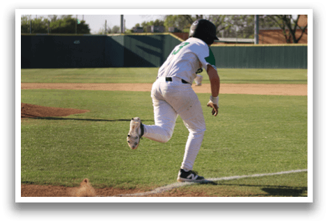 A baseball player is running towards home plate, wearing a white uniform. AI generated content