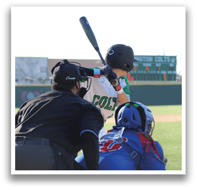 A baseball player is holding a bat, ready to swing, while a catcher and an umpire are positioned behind him. AI generated content