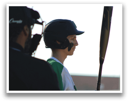 A baseball player holding a bat, wearing a helmet and a green shirt. AI generated content