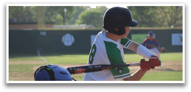 A baseball player in a white uniform is swinging a bat, attempting to hit a ball. The catcher is positioned behind him, wearing a baseball glove. AI generated content