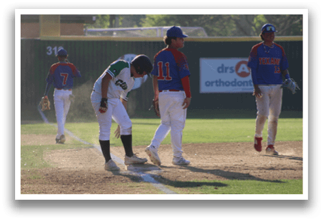 Baseball players on a field, one of them bending over. AI generated content