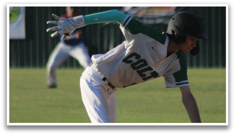 A baseball player is running on the field, wearing a white uniform and a black helmet. AI generated content