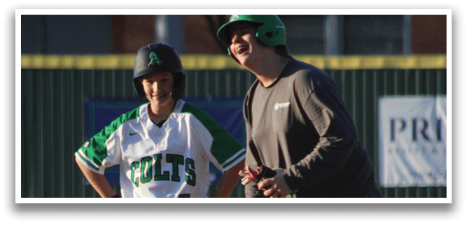 A man and a boy are standing on a baseball field. The man is wearing a green hat and a gray shirt. The boy is wearing a white shirt and a green hat. AI generated content