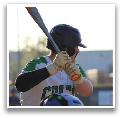 A baseball player in a green and white uniform is holding a bat, preparing to swing at a pitch. AI generated content
